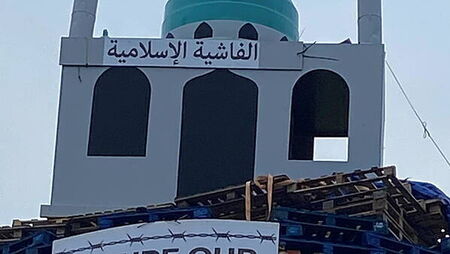 Replica of mosque placed on top of loyalist bonfire in Tyrone