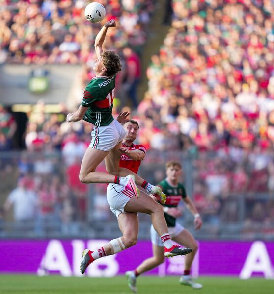 Kobe McDonald of Mayo climbs above Sam Mulroy of Louth to contest a kickout. Kobe McDonald of Mayo climbs above Sam Mulroy of Louth to contest a kickout.