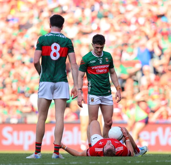 Jack Coyne and Bob Tuohy (8) of Mayo stand over grounded Louth attacker Conor Grimes. Picture: INPHO/Tom O’Hanlon Jack Coyne and Bob Tuohy (8) of Mayo stand over grounded Louth attacker Conor Grimes. Picture: INPHO/Tom O’Hanlon