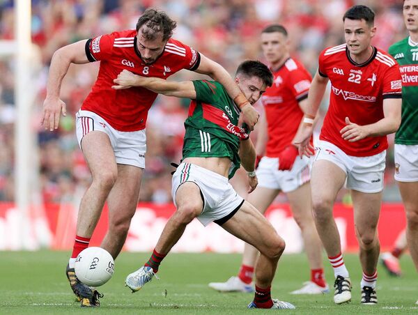 Louth's Conor Early in a battle for possession with Mayo defender Enda Hession. Picture: INPHO/Laszlo Geczo Louth's Conor Early in a battle for possession with Mayo defender Enda Hession. Picture: INPHO/Laszlo Geczo