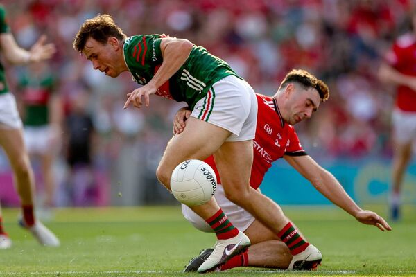 Mayo's Paul Towey is challenged for the ball by Louth's Emmet Carolan. Picture: INPHO/James Crombie Mayo's Paul Towey is challenged for the ball by Louth's Emmet Carolan. Picture: INPHO/James Crombie
