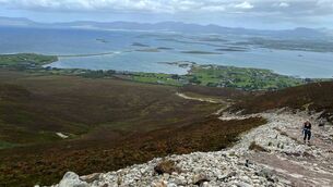 <p>A lone pilgrim sets off to climb Croagh Patrick against the backdrop of the magnificent Clew Bay. 	Picture: David Farrell Photograpy</p>