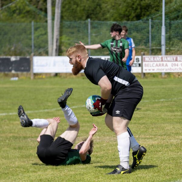 Manulla goalkeeper Matthew Flanagan collects the ball as Eoin Prendergast hits the deck to win a penalty for Conn Rangers. Picture: John Corless Manulla goalkeeper Matthew Flanagan collects the ball as Eoin Prendergast hits the deck to win a penalty for Conn Rangers. Picture: John Corless