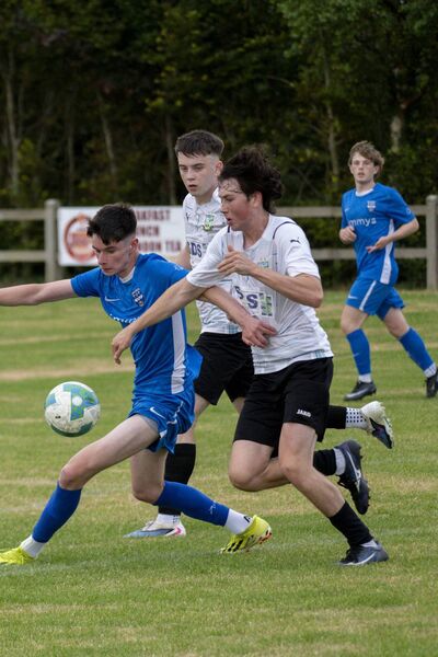 From left, Ballina Town's Jack O'Brien and Ballyheane's Dylan Stevenson and Donie Behan. In the background, Ballina Town's Oran Canavan. Picture: John Corless