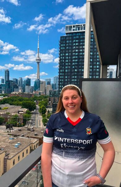 Siobhán Glacken wearing her Mayo jersey on her balcony with the Toronto skyline in the background. Siobhán Glacken wearing her Mayo jersey on her balcony with the Toronto skyline in the background.