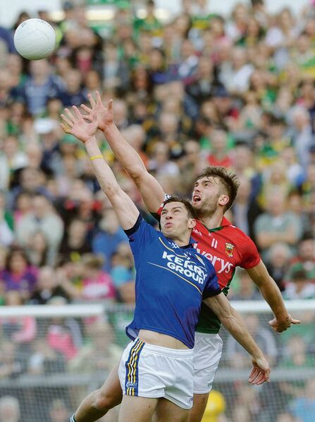 Mayo's Aidan O'Shea and Kerry's David Moran contest the ball as their bodies appear synchronised during the 2014 All-Ireland senior football championship semi-final replay at the Gaelic Grounds in Limerick. Picture: David Farrell Photography Mayo's Aidan O'Shea and Kerry's David Moran contest the ball as their bodies appear synchronised during the 2014 All-Ireland senior football championship semi-final replay at the Gaelic Grounds in Limerick. Picture: David Farrell Photography