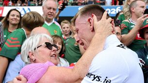 <p>Ryan O'Donoghue of Mayo is congratulated by his mother Brenda afterAll-Ireland final. He will bring Sam Maguire to Belmullet this evening. Pic: Ray McManus/Sportsfile</p>