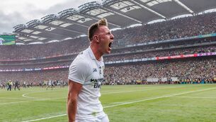 <p>Ryan O'Donoghue celebrates after the All-Ireland final. He and clubmate Séamus Howard will bring Sam Maguire home to Belmullet this evening. Pic: INPHO/James Crombie</p>