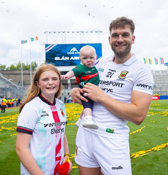 Aidan O'Shea savours the moment with his daughters Caragh and Romee.	Picture: INPHO/Tom O’Hanlon