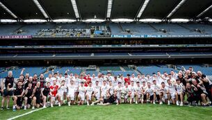 <p>The Mayo players and backroom staff celebrate with the Sam Maguire Cup after their historic All-Ireland Final success. Picture: INPHO/Tom Maher</p>