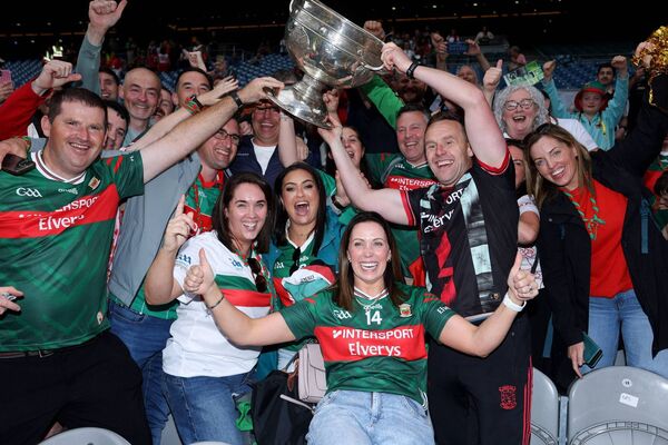 Andy Moran celebrates with Mayo supporters after lifting the Sam Maguire Cup for the first time since 1951. 	Picture: INPHO/Tom Maher