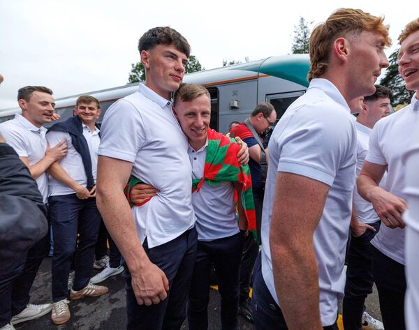 Ryan O'Donoghue celebrates with Bob Tuohy at the Mayo team's arrival to Castlebar Train Station for last week's homecoming celebrations following their All-Ireland SFC Final win against Kerry. Picture: INPHO/James Crombie Ryan O'Donoghue celebrates with Bob Tuohy at the Mayo team's arrival to Castlebar Train Station for last week's homecoming celebrations following their All-Ireland SFC Final win against Kerry. Picture: INPHO/James Crombie