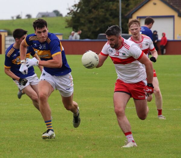 Brendan Harrison goes on the attack for Aghamore as Mayo Gaels' Jack Fallon gives chase. Brendan Harrison goes on the attack for Aghamore as Mayo Gaels' Jack Fallon gives chase.
