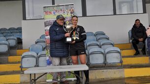 <p>Castlebar Town captain and player of the match Amy Dowling accepts the Rumley Cup from Tommy Rumley. Picture: Dee Ryan</p> <p>Castlebar Town captain and player of the match Amy Dowling accepts the Rumley Cup from Tommy Rumley. Picture: Dee Ryan</p>