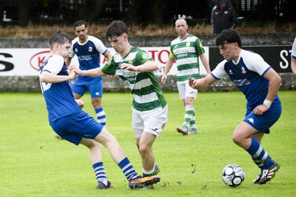 Castlebar Celtic midfielder Oran Murphy is challenged by Tulla United duo Darragh Baker and Conor McFadden. Picture: John Corless