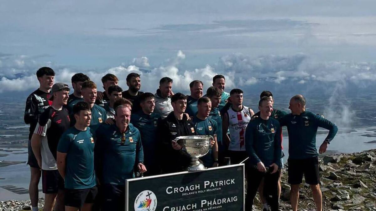 Mayo team bring Sam Maguire to the top of Croagh Patrick