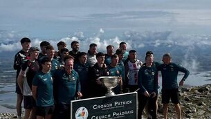 <p>Mayo team and management pictured with Sam Maguire at the top of Croagh Patrick today. Pic: Tuam Archdiocese</p> <p>Mayo team and management pictured with Sam Maguire at the top of Croagh Patrick today. Pic: Tuam Archdiocese</p>