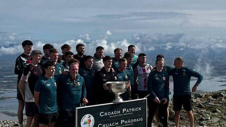Mayo team bring Sam Maguire to the top of Croagh Patrick 