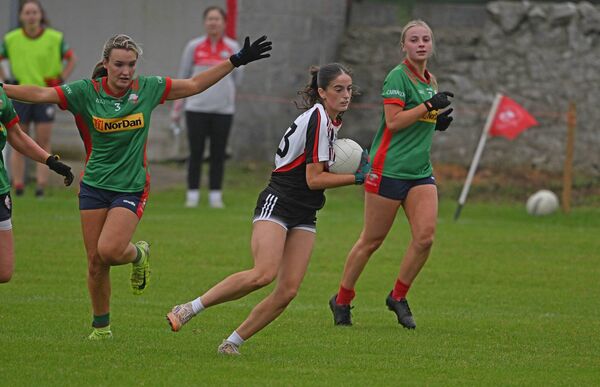 Swinford-Killasser's Emily Gavin gets past Carnacon's defenders during the AbbVie Mayo LIFC game in Clogher. Picture: Conor McKeown Swinford-Killasser's Emily Gavin gets past Carnacon's defenders during the AbbVie Mayo LIFC game in Clogher. Picture: Conor McKeown