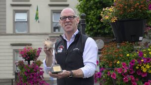 <p>Ray Walsh of Mayo Mountain Rescue pictured with the organisation’s bespoke trophy after Mayo Mountain Rescue was named one of the National Lottery’s 2026 Good Cause Legends. Pic: Michael McLaughlin / Julien behal Photography</p> <p>Ray Walsh of Mayo Mountain Rescue pictured with the organisation’s bespoke trophy after Mayo Mountain Rescue was named one of the National Lottery’s 2026 Good Cause Legends. Pic: Michael McLaughlin / Julien behal Photography</p>