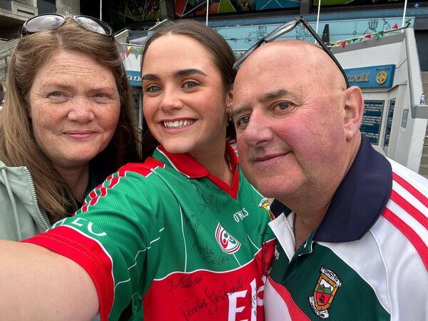Belmullet man Adrian Kilker with his wife Ann and daughter Ellie before the game 