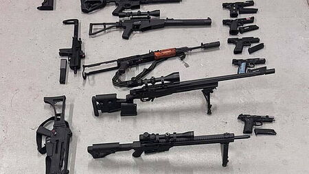 Two men arrested after 22 fake firearms and cannabis seized