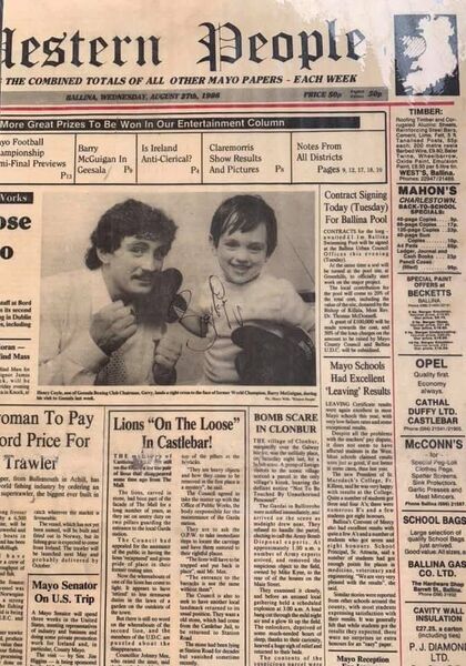A copy of the Western People, signed by Barry McGuigan, alongside Barry is another future boxing champ, Henry Coyle.