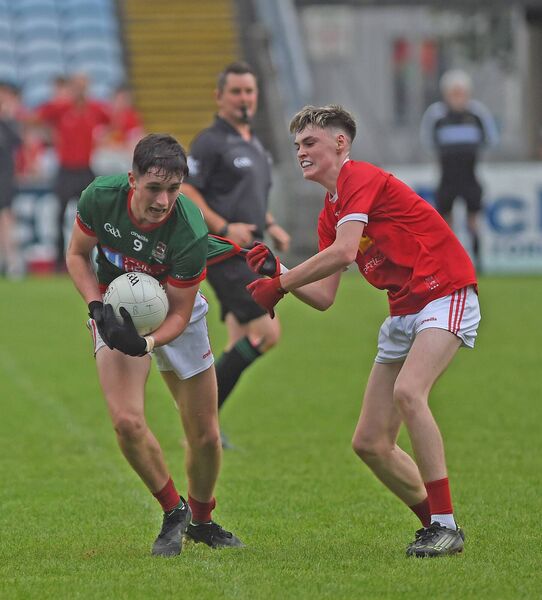 Ballina Stephenites midfielder Conor Jordan tries to get past Ballintubber 's Finnian Brady. Picture: Conor McKeown Ballina Stephenites midfielder Conor Jordan tries to get past Ballintubber 's Finnian Brady. Picture: Conor McKeown