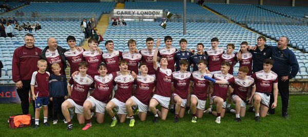 The victorious Crossmolina team and management celebrate with the trophy after the Mayo GAA Homeland Minor 'D' football championship final at Hastings Insurance MacHale Park, Castlebar, last Sunday.	Pictures: David Farrell Photography 
