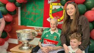 <p>Noel Acton, a patient at St Augustine’s Community Nursing Unit, Ballina was reunited with Sam Maguire for the first time since his brother Tom won the famous cup with Mayo in 1950</p>