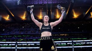 <p>Katie Taylor prepares to lay her boxing gloves on the canvas to signify her retirement after last Saturday's night win against Flora Pili at a sold-out Croke Park. Picture: INPHO/Gary Carr</p> <p>Katie Taylor prepares to lay her boxing gloves on the canvas to signify her retirement after last Saturday's night win against Flora Pili at a sold-out Croke Park. Picture: INPHO/Gary Carr</p>