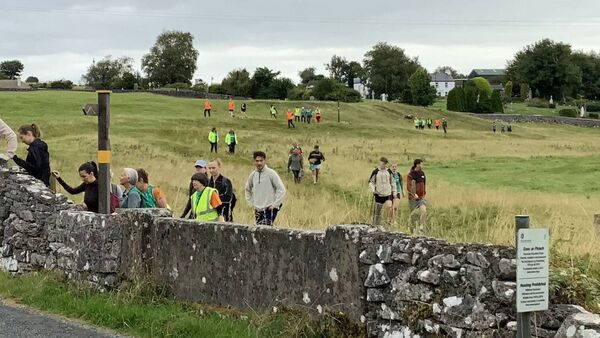 Some of the large group of participants setting out on the recent Gerry Biggins Memorial Walk to Croagh Patrick. Picture by Tom Quinn.