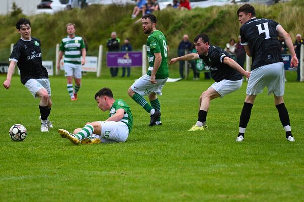 Castlebar Celtic's Luke Kelly gets the ball and hits the ground, with, from left, James Morley (Claremorris) Ben Murphy and Dylan Edwards (Castlebar Celtic), Ryan McLoughlin and Noel Mellett (Claremorris watching on). Picture: John Corless Castlebar Celtic's Luke Kelly gets the ball and hits the ground, with, from left, James Morley (Claremorris) Ben Murphy and Dylan Edwards (Castlebar Celtic), Ryan McLoughlin and Noel Mellett (Claremorris watching on). Picture: John Corless