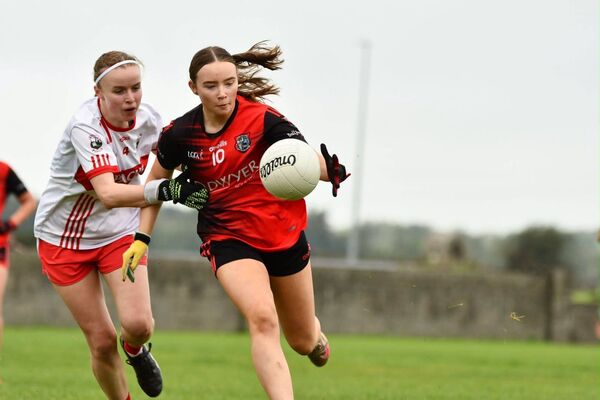 Erin Higgins of Ballyhaunis is marked closely by Aghamore corner-back Aoife Doherty. Picture: Ballyhaunis LGFA/Facebook