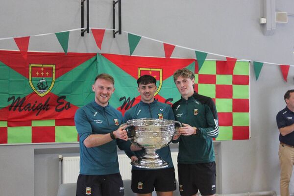 Darren McHale, Liam Golden, Kobe McDonald and the Sam Maguire  trophy in Breaffy NS, Ballina, where Darren is the 6th Class teacher