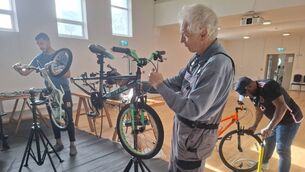 <p>Volunteers busy at work at the bicycle repair clinic, a monthly initiative run by Ballyhaunis Community Council at the Community Hall.</p>