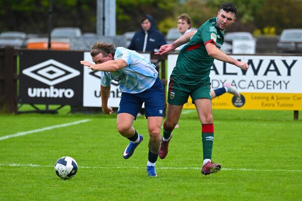Salthill Devon's Cole Connolly is challenged by Mayo’s Óisin O’Reilly. Picture: John Corless