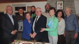 <p>Cutting the memorial cake at Culture Night in Kilmovee Community Centre from Ireland West Camino were John Cannon, Sr Maureen, Cathaoirleach Mayo County Council John Caulfield, Mary B Prendergast and Jeremi Salatova together with local people. Pic James Hunt.</p>