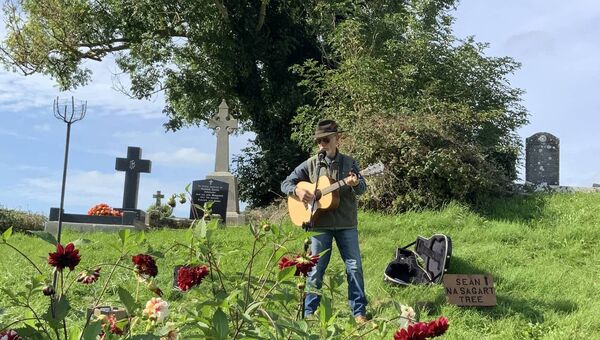 Charlie Keating performs an original song recounting the life of the 18th-century priest hunter Seán na Sagart which formed part of the Abbey’s recent historical program. Picture by Tom Quinn. Charlie Keating performs an original song recounting the life of the 18th-century priest hunter Seán na Sagart which formed part of the Abbey’s recent historical program. Picture by Tom Quinn.