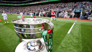 <p>Mayo players run past the Sam Maguire Cup ahead of the GAA Football All-Ireland Senior Championship final match between Kerry and Mayo at Croke Park in Dublin. Photo by Stephen McCarthy/Sportsfile</p>