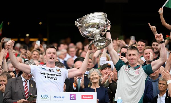 Brothers Diarmuid, left, and Cillian O'Connor lift the Sam Maguire Cup. 