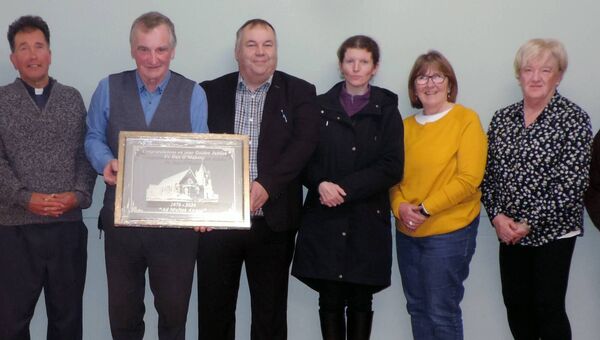 At a recent meeting of Kilmovee Pastoral Council Thomas Regan chairperson made a presentation to Fr Dan O'Mahony in recognition of his 50 years service to his people. Pictured from left are; Martina McLoughlin, Fr Joseph Gavigan PP, Fr Dan, Thomas Regan, Anna Marie Tiernan, Mary Anne Fermoy, Mary Teresa Duffy, and Tina Coakley. Pic James Hunt Photography. At a recent meeting of Kilmovee Pastoral Council Thomas Regan chairperson made a presentation to Fr Dan O'Mahony in recognition of his 50 years service to his people. Pictured from left are; Martina McLoughlin, Fr Joseph Gavigan PP, Fr Dan, Thomas Regan, Anna Marie Tiernan, Mary Anne Fermoy, Mary Teresa Duffy, and Tina Coakley. Pic James Hunt Photography.