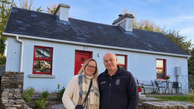 <p>Estelle and Erwan Seznec outside their restored cottage near Urlaur.</p>