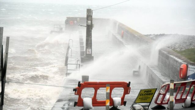 <p>Waves battering a pier during Storm Amy. Picture: John O'Grady</p>