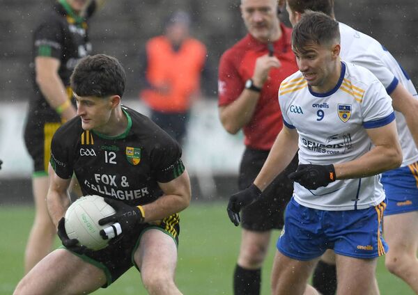 Stephen Rochford gains possession of the ball for Ardagh as Eastern Gaels’ Henry Concannon looks on. Picture: David Farrell