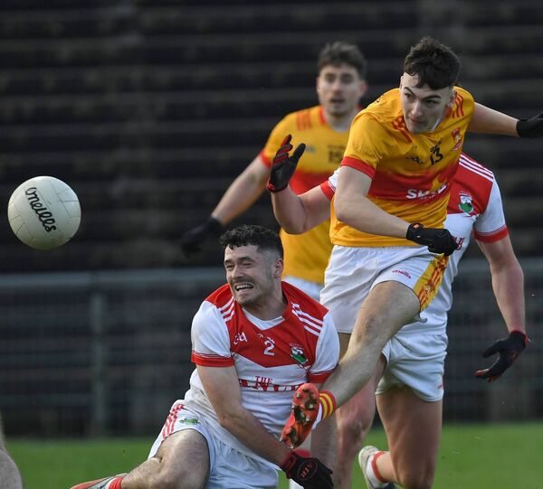 Cian Walsh of Castlebar Mitchels shoots for the posts despite the best effort of Garrymore’s Colin Commins. Picture: David Farrell Photography Cian Walsh of Castlebar Mitchels shoots for the posts despite the best effort of Garrymore’s Colin Commins. Picture: David Farrell Photography