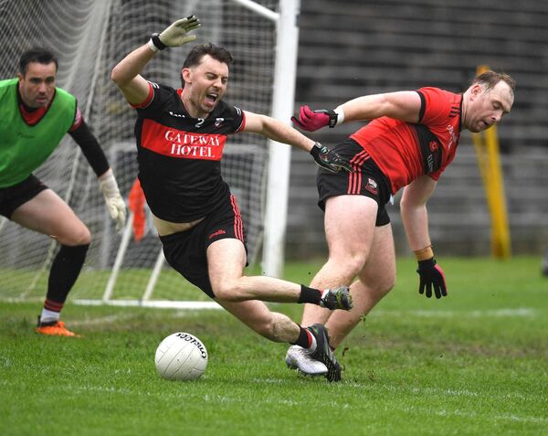 Swinford’s Alan McLoughlin tussles for the ball with Ballycastle’s Finn McDermott Cox. Picture: David Farrell Photography Swinford’s Alan McLoughlin tussles for the ball with Ballycastle’s Finn McDermott Cox. Picture: David Farrell Photography
